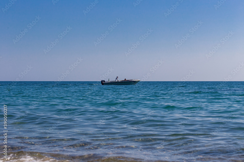 View of a fast boat moving along the sea coast