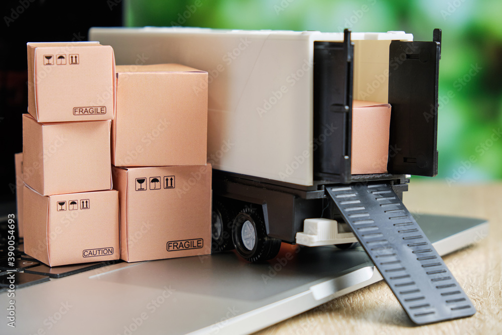 The concept of delivery of goods from a warehouse by courier through an order on the Internet The concept of delivery of goods from a warehouse by courier through an order on the Internet