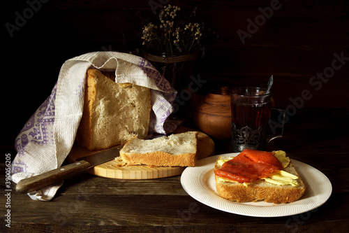 Sandwich with butter and red fish.