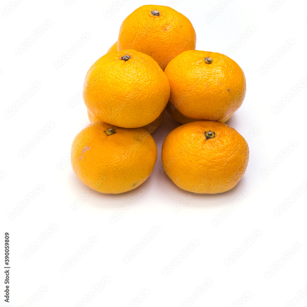 Tangerines on a white background, isolated, copy space, top view, close-up Tangerines on a white background, isolated, copy space, top view, close-up