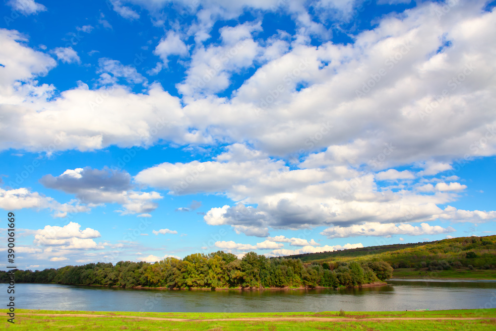 Clouds over the river . Awesome riverside scenery Clouds over the river . Awesome riverside scenery