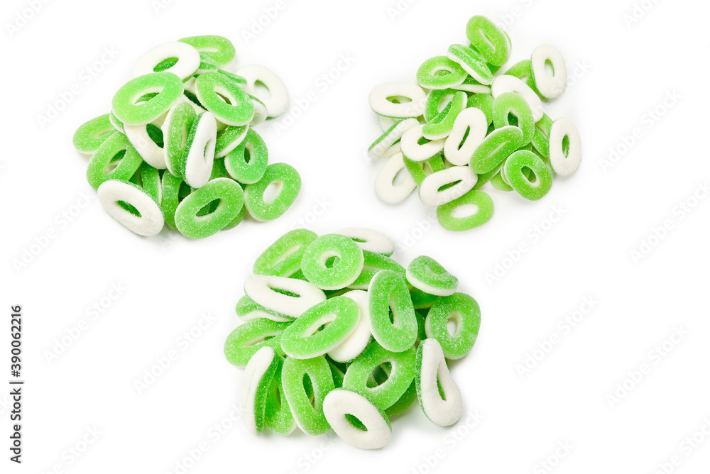 Green gummy candies rings isolated on white. Top view. Jelly sweets. Green gummy candies rings isolated on white. Top view. Jelly sweets.