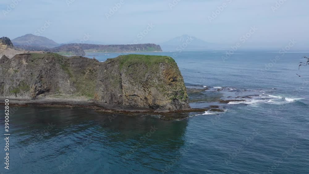 beautiful landscapes view of the Kunashir island and the sea coast with mountains and Tyatya volcano beautiful landscapes view of the Kunashir island and the sea coast with mountains and Tyatya volcano