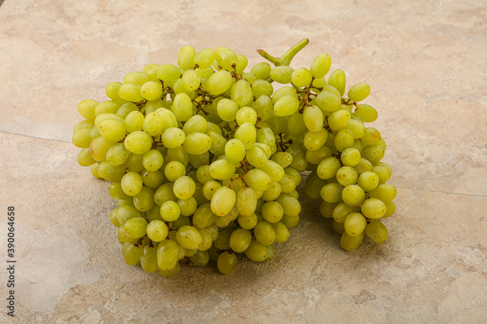 Green grape branch over background Green grape branch over background