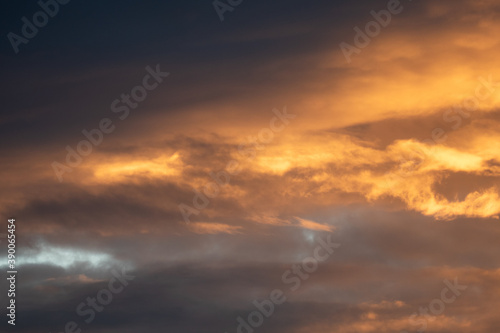 Dense grey clouds are partially colored reddish during a sunset, sky wallpapers