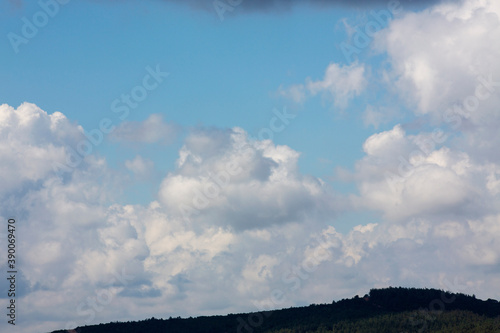White clouds cumulus floating on blue sky for backgrounds concept
