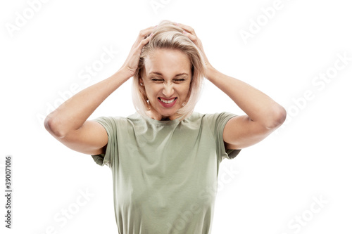 Wallpaper Mural Young blond woman holding her head with her hands. Stress, pain and negativity. Isolated on white background. Torontodigital.ca
