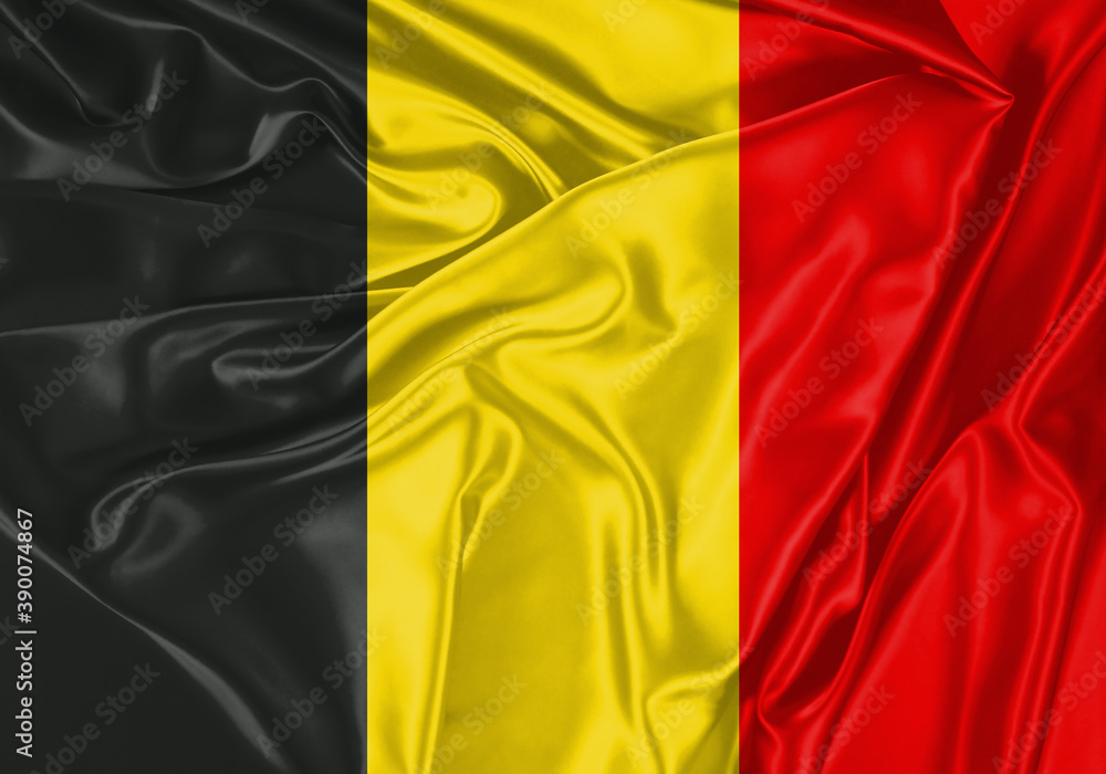 Belgium flag waving in the wind. National flag on satin cloth surface texture. Background for international concept.