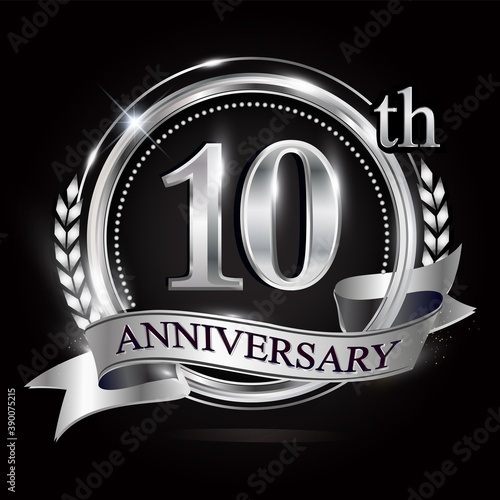Celebrating 10th anniversary logo, with silver ring and ribbon.