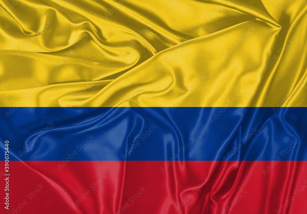 Fototapeta premium Colombia flag waving in the wind. National flag on satin cloth surface texture. Background for international concept.