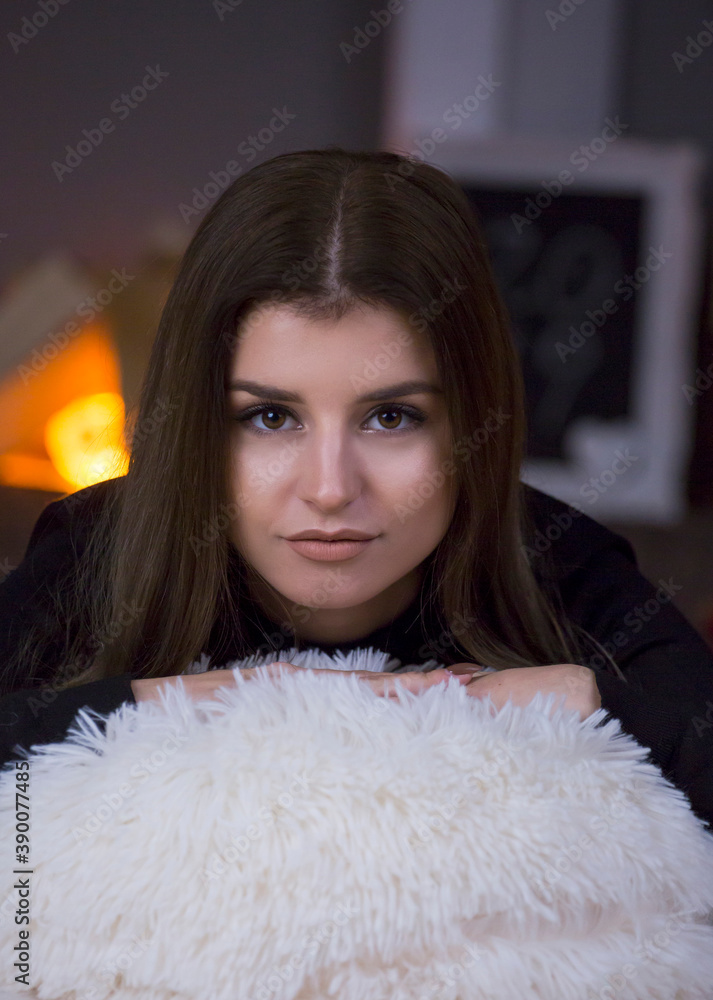 woman cozy portrait fire place in the background woman cozy portrait fire place in the background