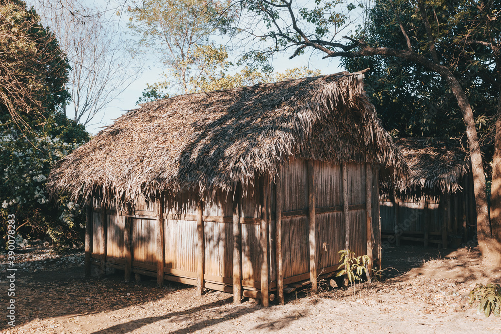 Traditional wooden african malagasy hut with roof from straw, typical village in north west Madagascar. Madagascar landscape.