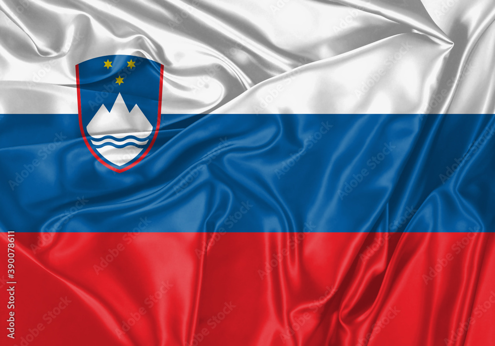 Fototapeta premium Slovenia flag waving in the wind. National flag on satin cloth surface texture. Background for international concept.