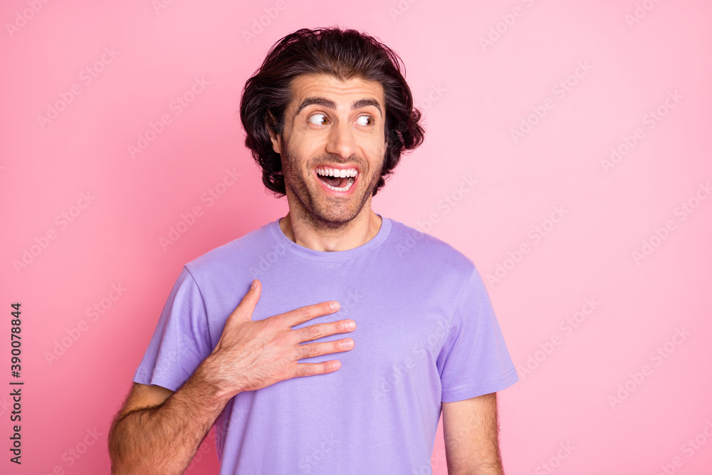 Photo of young brown hair stubble man excited amazed surprised hand touch chest look empty space isolated over pink color background Photo of young brown hair stubble man excited amazed surprised hand touch chest look empty space isolated over pink color background