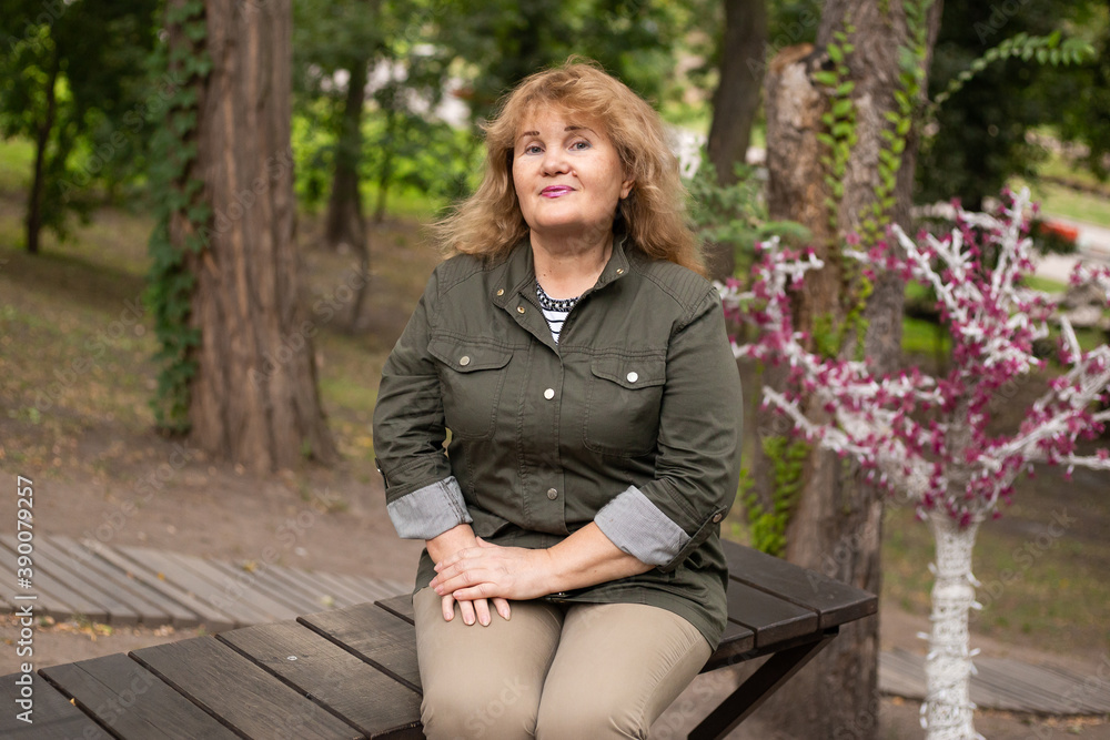 senior woman in autumn park on nature senior woman in autumn park on nature