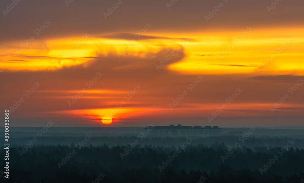 Early morning. Beautiful sunrise over the forest.