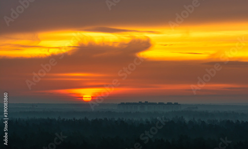 Early morning. Beautiful sunrise over the forest.