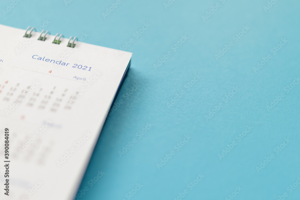 2021 calendar page on blue background business planning appointment meeting concept 2021 calendar page on blue background business planning appointment meeting concept