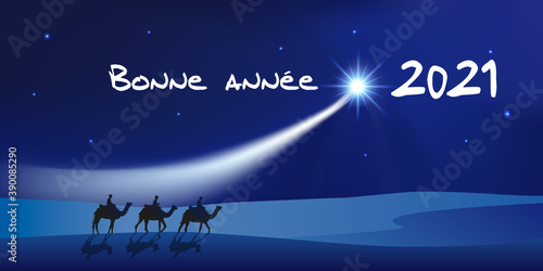 Carte de vœux 2021 montrant les trois rois mages à dos de dromadaire se dirigeant vers Bethléem avec des cadeaux pour célébrer la naissance de Jésus Christ.