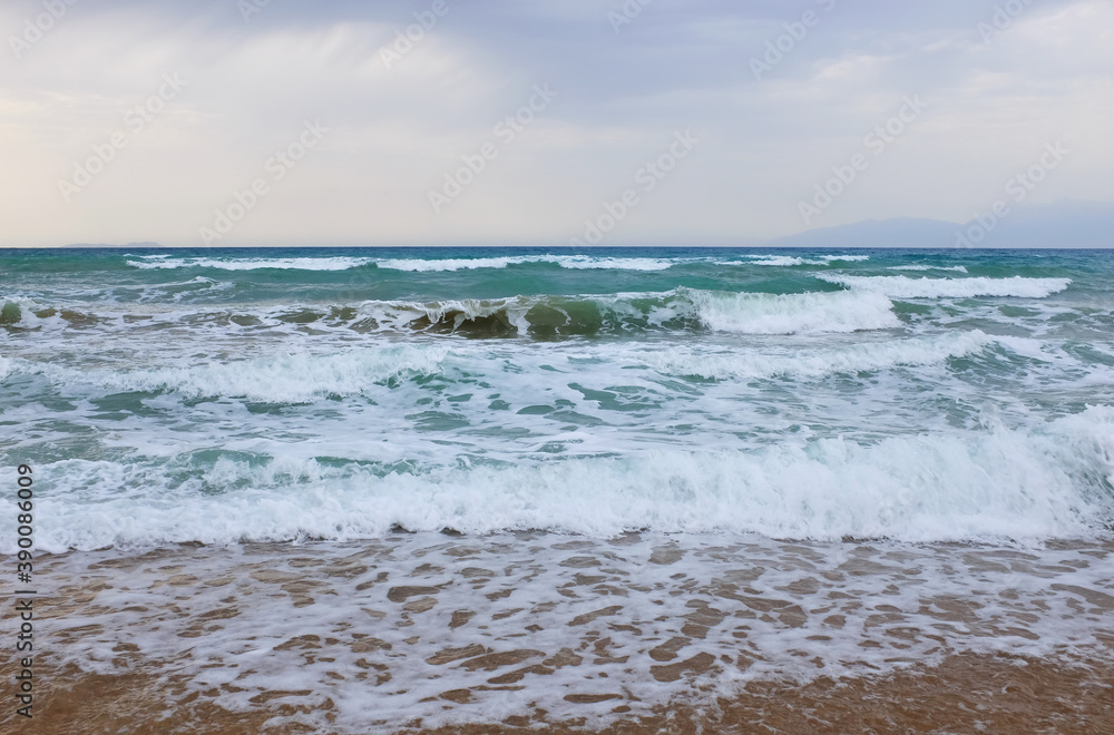 Beach and sea sunset at greek beach. Amazing landscape with abstract water colors Beach and sea sunset at greek beach. Amazing landscape with abstract water colors