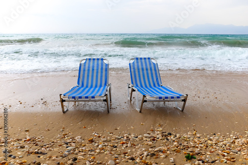 beach chairs on green sandy beach