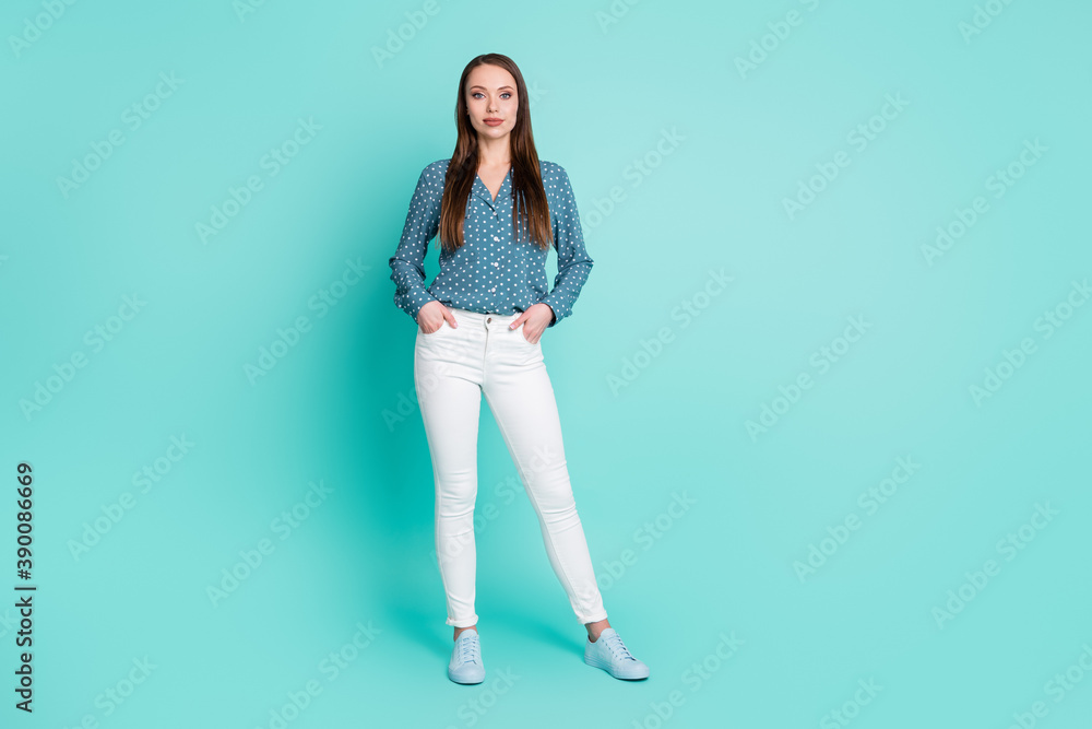 Full body photo of intelligent chief lady stand isolated over turquoise color background put hands in pockets Full body photo of intelligent chief lady stand isolated over turquoise color background put hands in pockets