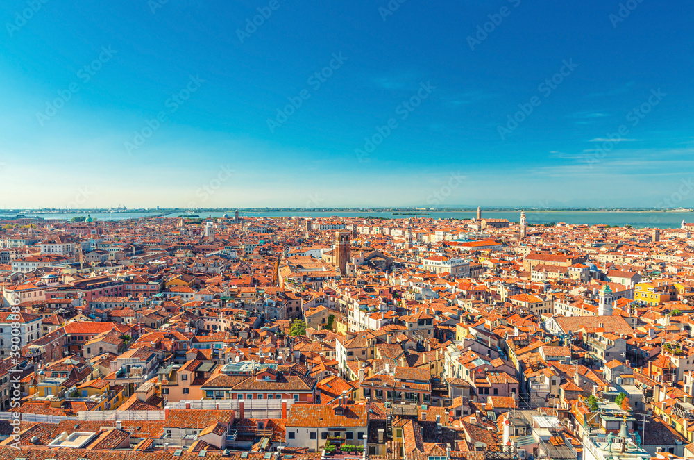 Aerial panoramic view of Venice city old historical centre, buildings with red tiled roofs, San Giuliano Mestre and blue sky background, Veneto Region, Northern Italy. Amazing Venice cityscape..