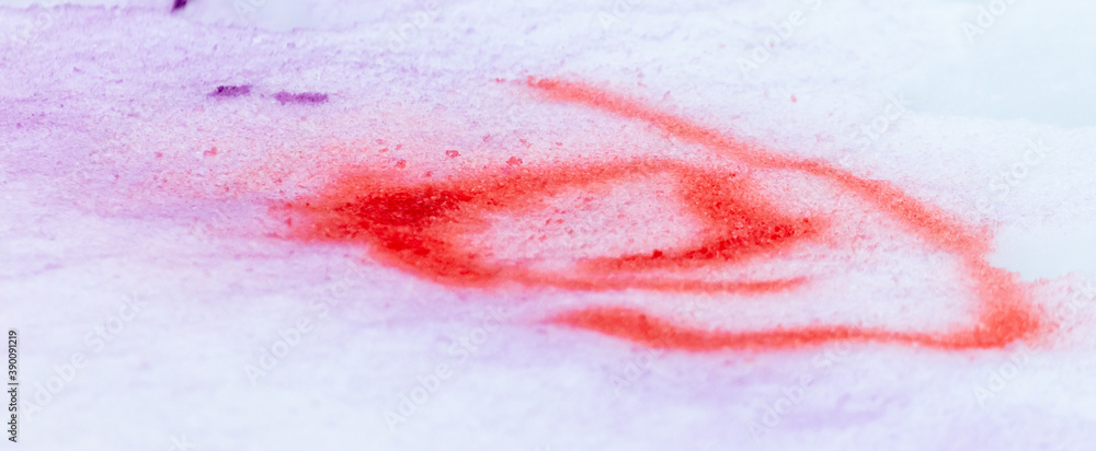 Red paint on the snow in winter.