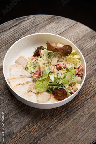 Caesar Salad with grilled chicken breast and parmesan cheese