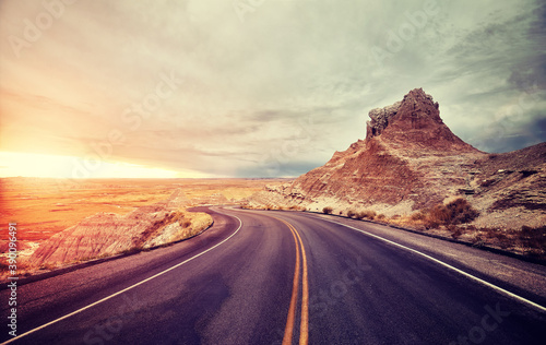 Scenic desert road at sunset, color toning applied, travel concept, USA.
