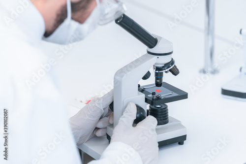 close up. scientist uses a microscope in a modern laboratory.