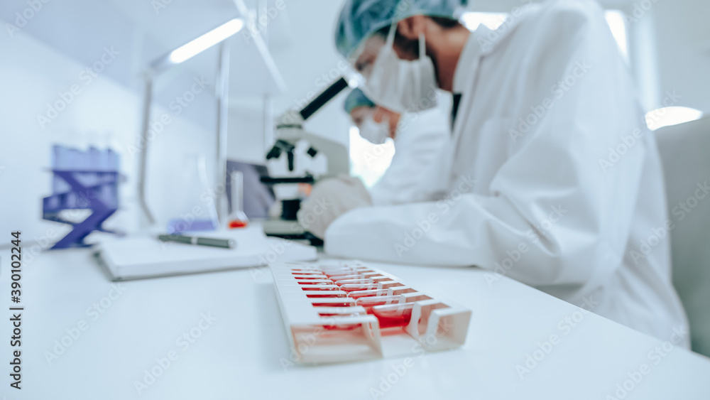 group of scientists conducts research in the laboratory . group of scientists conducts research in the laboratory .