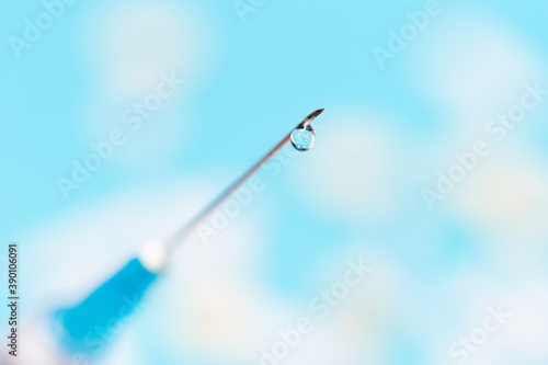 close up. drop of medicine on the needle of a syringe. © yurolaitsalbert