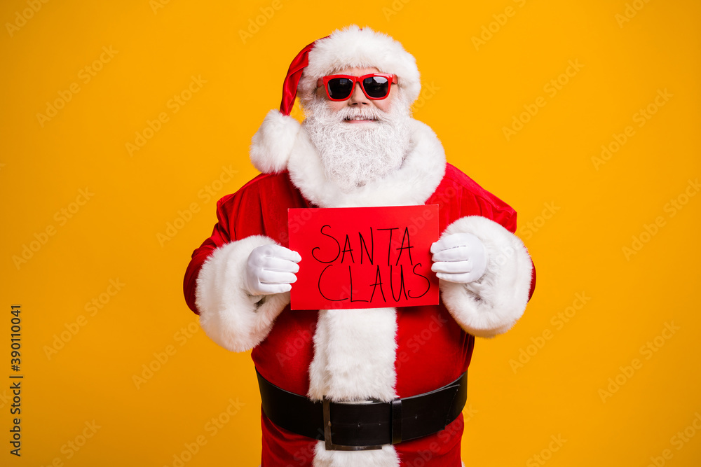 Portrait of his he nice attractive cheerful cheery confident bad Santa holding in hands red board wanted search seeking occupation isolated bright vivid shine vibrant yellow color background Portrait of his he nice attractive cheerful cheery confident bad Santa holding in hands red board wanted search seeking occupation isolated bright vivid shine vibrant yellow color background