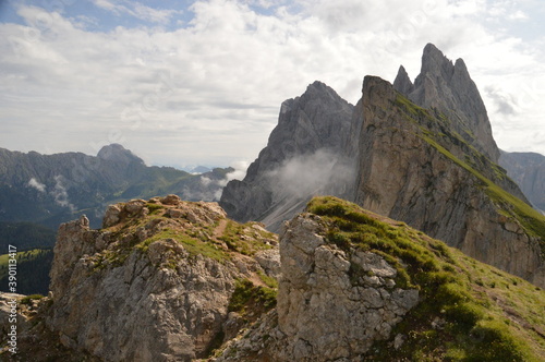 Hiking on the dramatic mountain ridge of Seceda in South Tyrol's Dolomites, Northern Italy