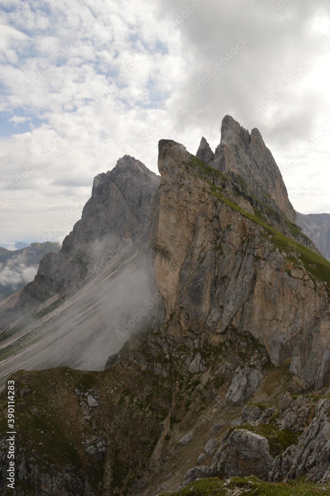 Hiking on the dramatic mountain ridge of Seceda in South Tyrol's Dolomites, Northern Italy Hiking on the dramatic mountain ridge of Seceda in South Tyrol's Dolomites, Northern Italy