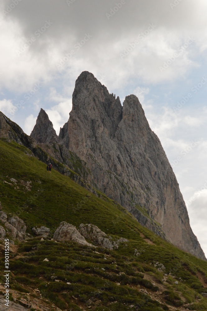 Hiking on the dramatic mountain ridge of Seceda in South Tyrol's Dolomites, Northern Italy Hiking on the dramatic mountain ridge of Seceda in South Tyrol's Dolomites, Northern Italy