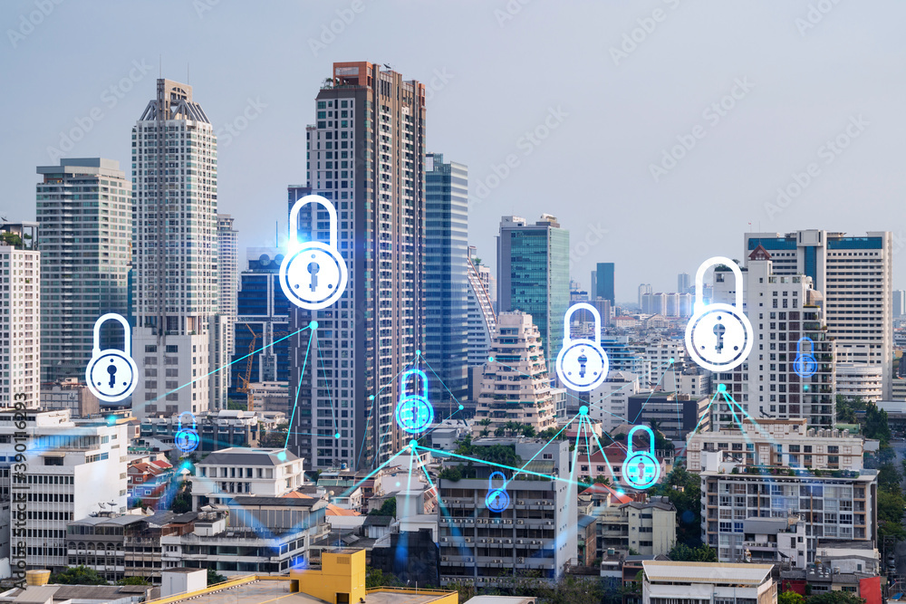 Obraz premium Padlock icon hologram over panorama city view of Bangkok to protect business in Asia. The concept of information security shields. Double exposure.