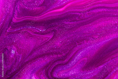 Abstract sparkling purple background. Close up of nail polish texture. Soft focus.