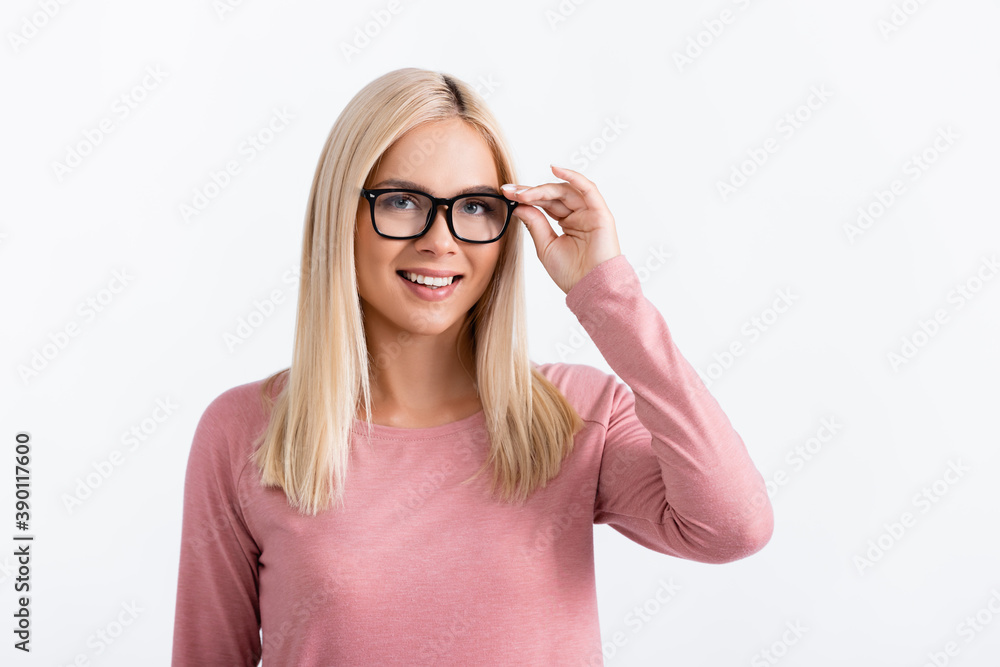 Young woman wearing eyeglasses and smiling at camera isolated on white