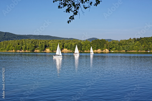 Yacht boats sailing at lake. Summer hobby 