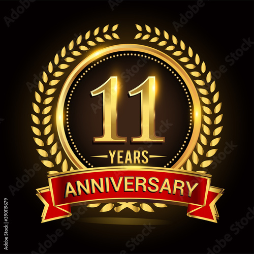 11th golden anniversary logo, with shiny ring and red ribbon, laurel wreath isolated on black background, vector design