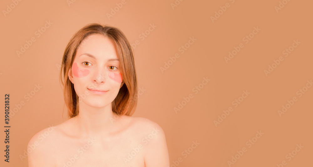 Girl with cosmetic patches under the eyes from fatigue. Copy space. Banner Girl with cosmetic patches under the eyes from fatigue. Copy space. Banner