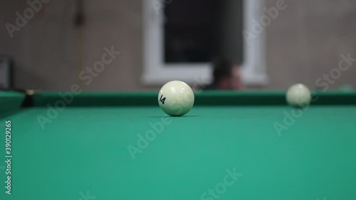 Wallpaper Mural Game of billiards. White billiard balls roll on the table. Sports entertainment in the bar. Simple background with a pool table. Balls hitting and moving. Torontodigital.ca