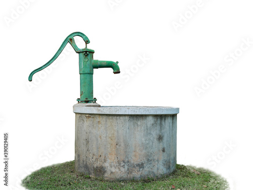 hand water pump with old pond on the green grass on isolate white background