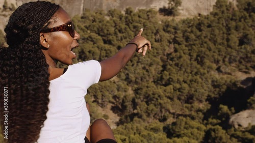 Beautiful Tourist Pointing Into Spanish Landscape