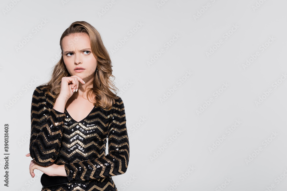 pensive young woman looking away isolated on grey pensive young woman looking away isolated on grey