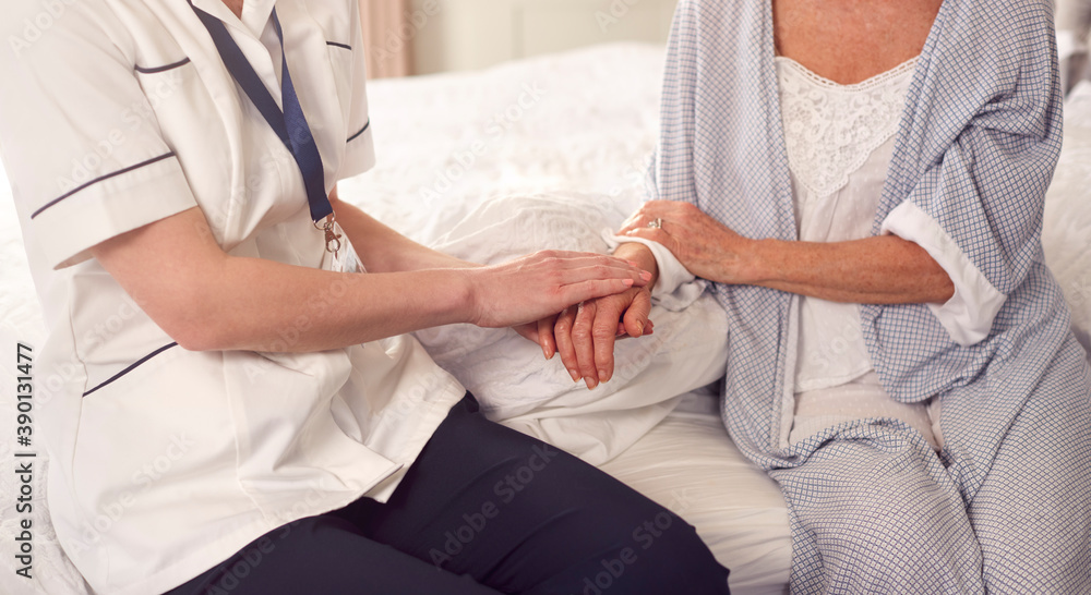 Close Up Of Female Doctor Making Home Visit To Senior Woman For Medical Check Offering Reassurance Close Up Of Female Doctor Making Home Visit To Senior Woman For Medical Check Offering Reassurance