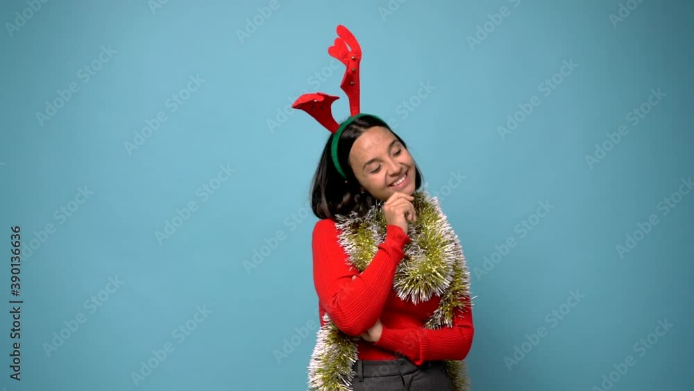 woman standing and looking to the side in christmas holidays woman standing and looking to the side in christmas holidays