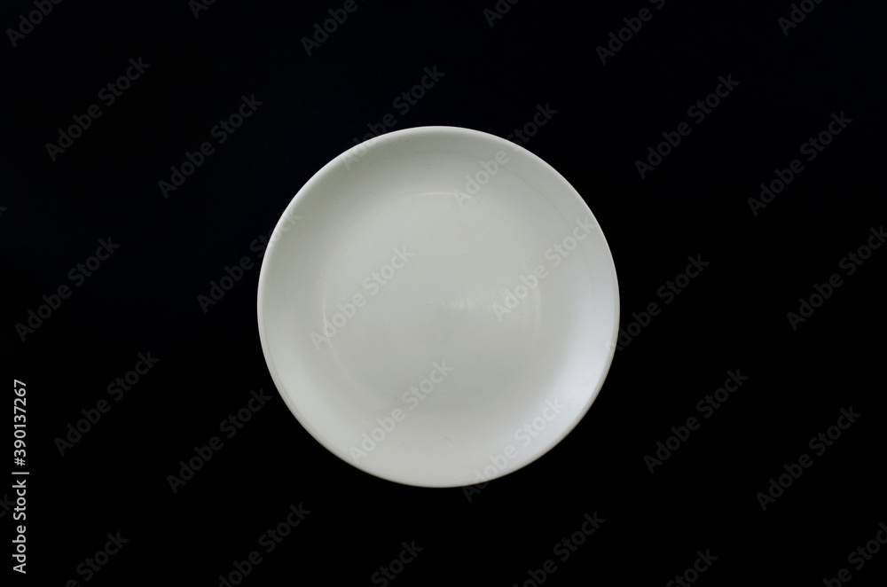 
white plate on black background. view from above